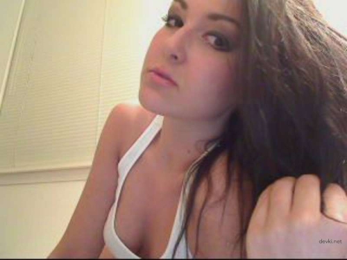 Sexy Brunette Poses in Front of Webcam: Hot Cam Girl Shows Off