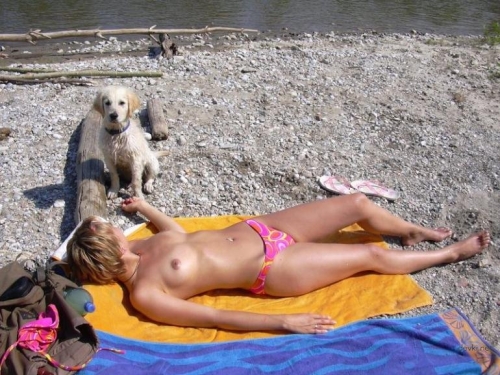 Topless Beach Babe: Sensual and Provocative Girl Sunbathing
