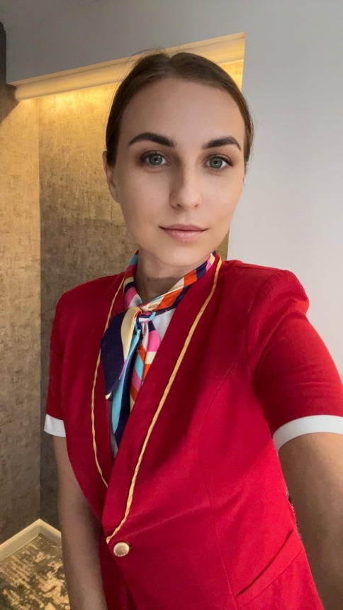 Sexy Stewardess Strips Naked Between Flights for Explicit Photoshoot