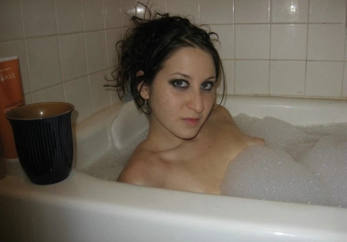 Seductive Beauty in the Bath: Naked Woman Relaxing in Bathtub