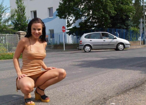 Sexy girl flaunts her hot ass naked on the street