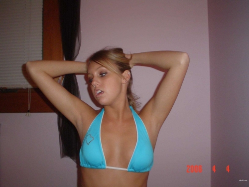 Sexy Girl in Blue Bikini: Sultry Beach Babe Poses Seductively