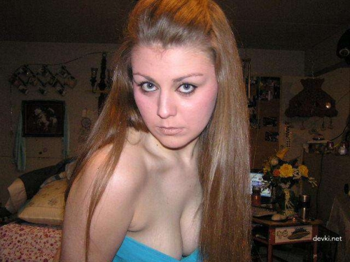 Explicit Selfie: Busty Girl Capturing Her Breasts
