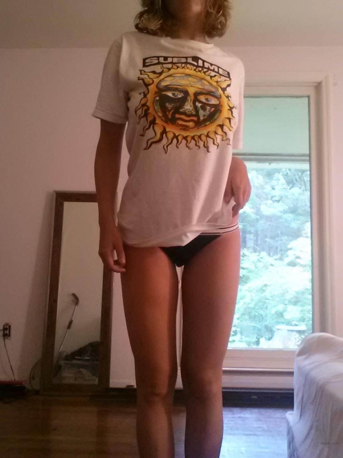 Sexy Young Woman Strips Down Displaying Seductive Curves