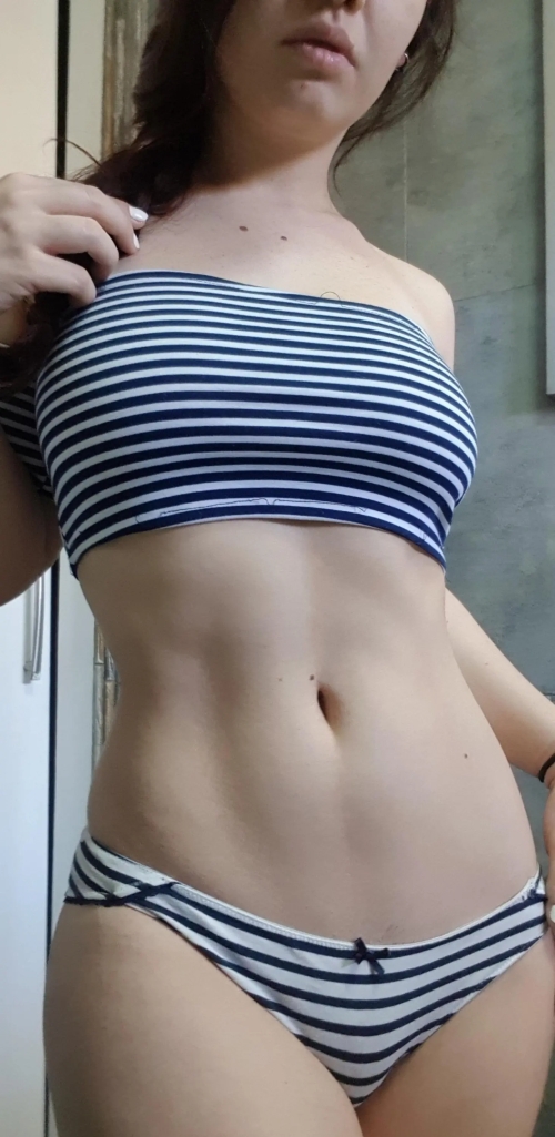 Seductive Woman Exposes Nude Body in Mysterious Pose