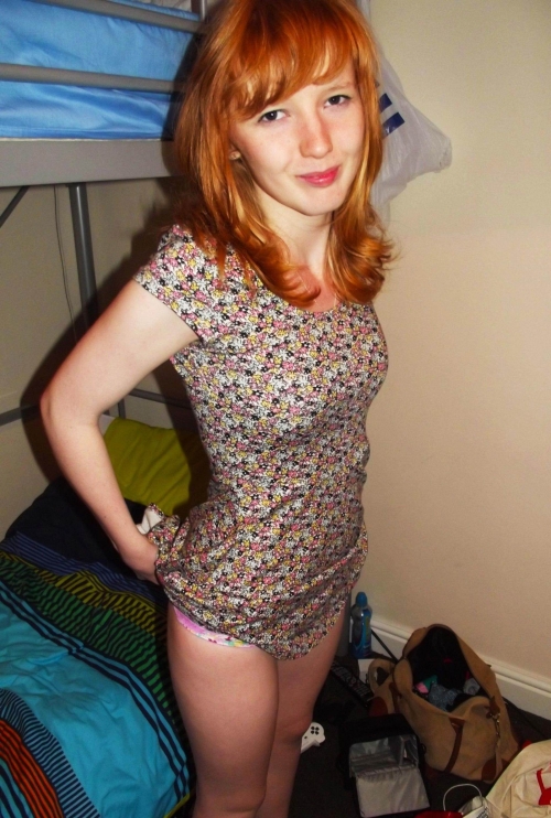 Fiery Redhead Sizzles in Erotic Photo Shoot