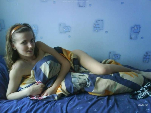 Petite Girlfriend with Tiny Tits Exposed in Provocative Pose