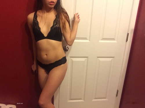 Sexy Girl in Stockings and Lingerie Poses Seductively