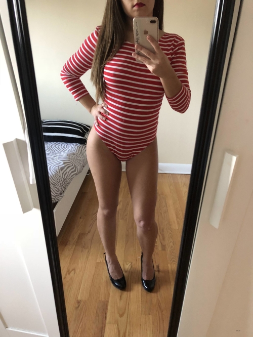 Striped Bodysuit Babe Flaunts Her Curves in Seductive Pose