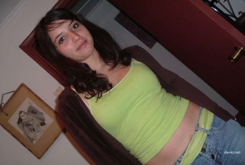 Naked Brunette with Hairy Pussy Exposed in Explicit Porn Photo