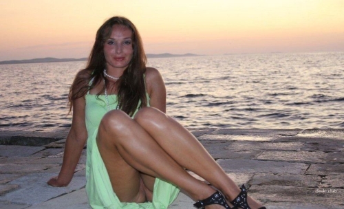 Explicit Intimate Photo of Woman in Fishnet Stockings