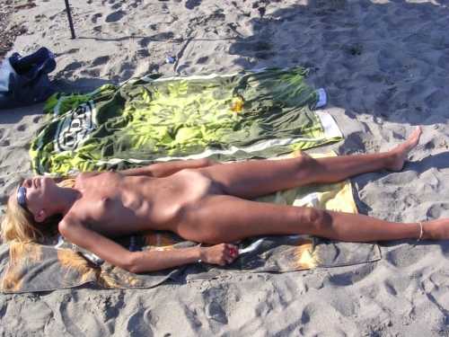 Fully Naked MILF on Beach: Explicit Nude Mature Woman Sunbathing
