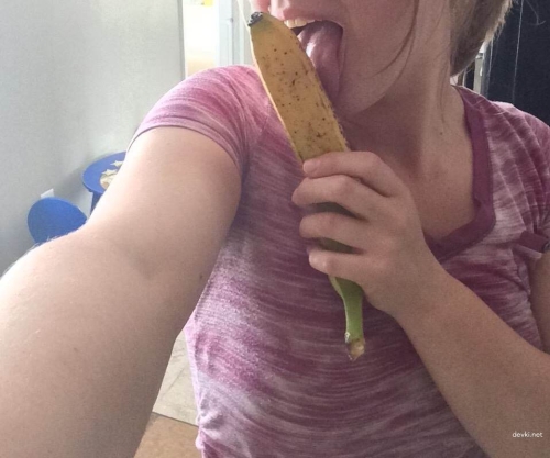 Young girl fucks herself with a banana - explicit solo masturbation porn photo.
