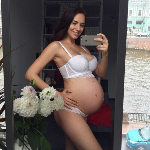 Explicit Pregnant Beauty in Erotic Pose