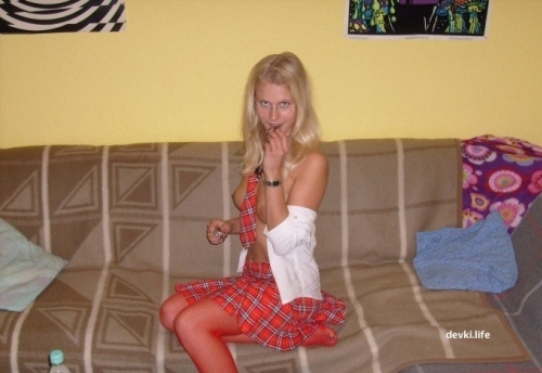 College Student Poses Pantyless at Home in Skirt for Explicit Photoshoot