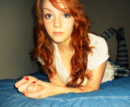 Redhead Flaunts Herself on Camera: Explicit Photoshoot