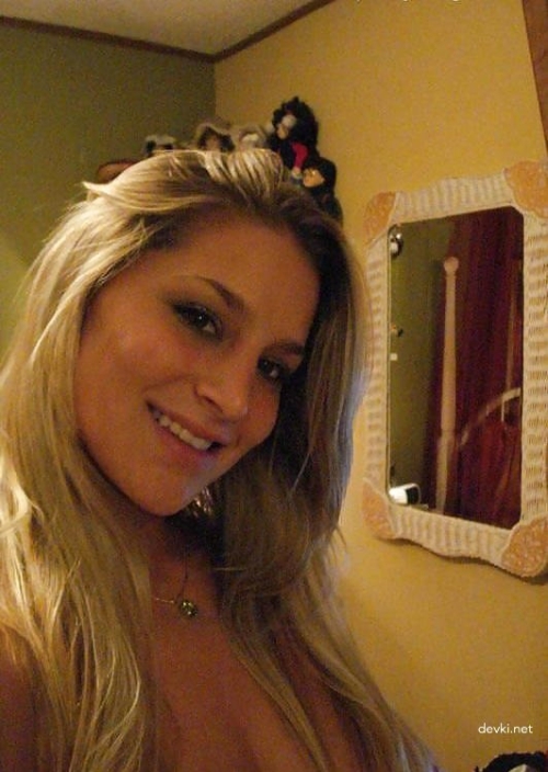 Topless Girl Selfie: Explicit Nude Photo of Young Woman