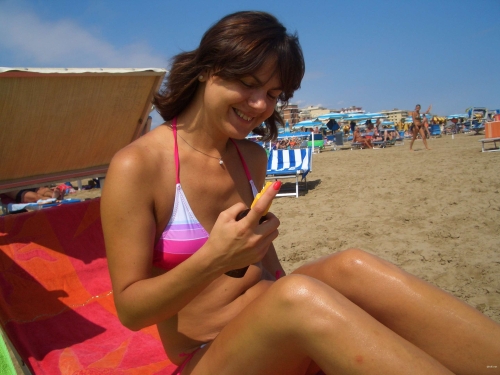 Topless Sunbathing: Sexy Girl with Bare Breasts on Beach