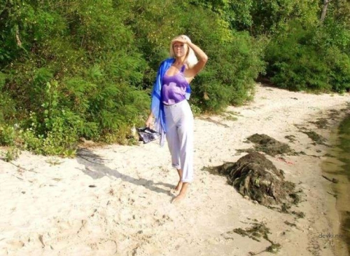 Blonde Sunbathing Naked: Explicit Nude Beach Photos
