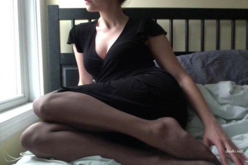Sexy babe in lingerie and stockings spreads legs on camera for explicit show