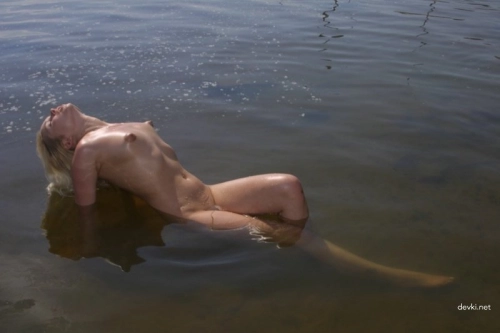 Sexy Babe Bathes in the Sea: Hot Beach Beauty in Bikini