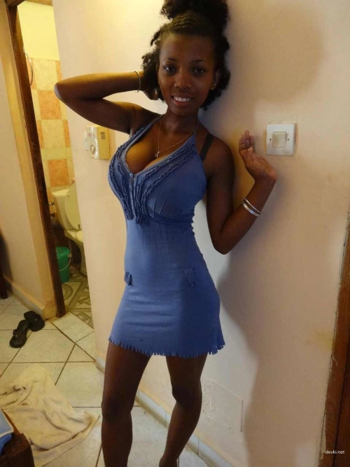 Black Woman Displays Enormous Breasts in Provocative Pose
