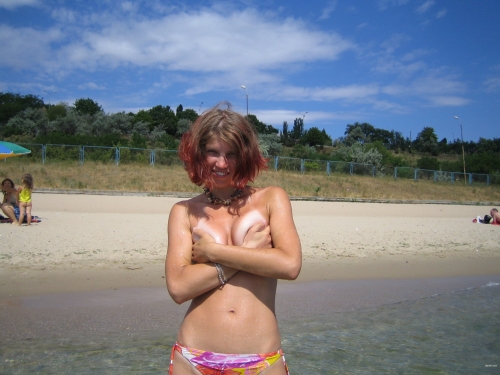 Beach Babe Flaunts Her Assets in Bold Display