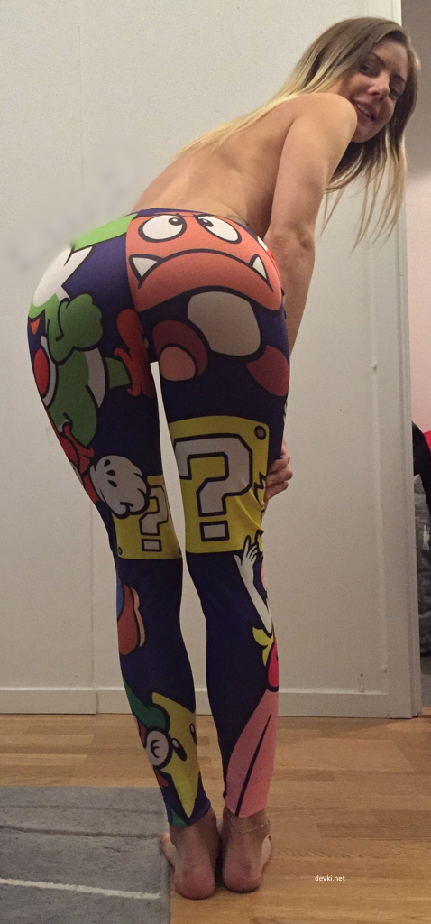 Girl pulling down leggings to reveal bare butt - Explicit and Provocative Photo