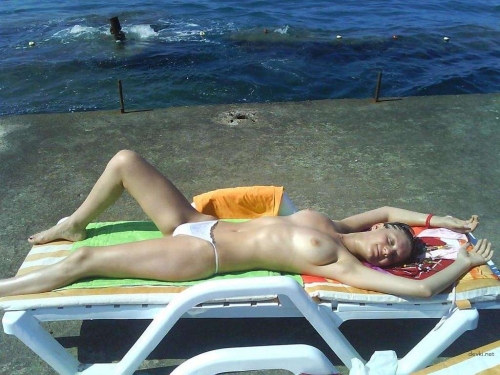 Sexy Girl on Vacation: Hot Bikini Babe Sunbathing on Beach