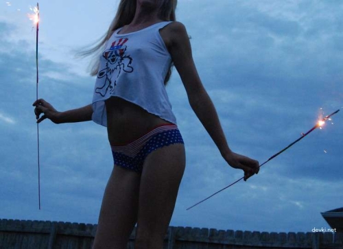 Topless Young Slender Blonde Beauty Exposing Her Breasts