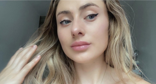 Sexy Blonde Nude Model Flaunts Attractive Breasts and Sensual Body