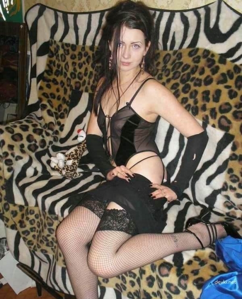 Naked on Couch: Explicit Nude Woman Posing Seductively