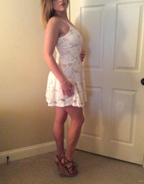 Seductive Girl in Dress Flaunts Her Assets - Explicit Photo