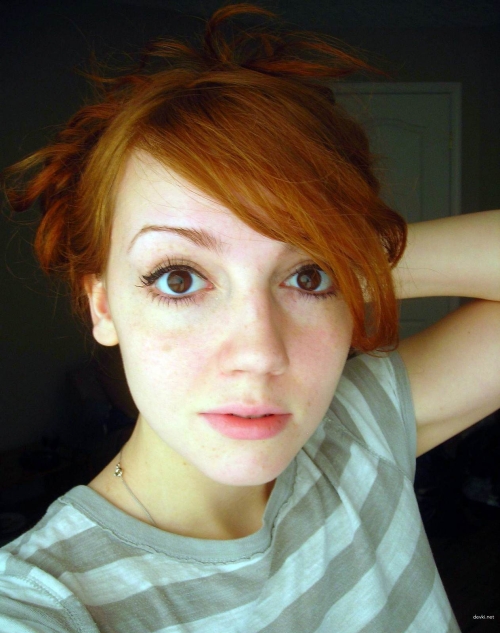 Sexy Redhead Poses Seductively Showing Off Her Pussy