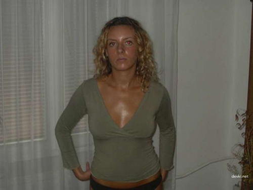 Sun-Kissed Babe Posing at Home: Hot and Tanned Beauty Showing Off