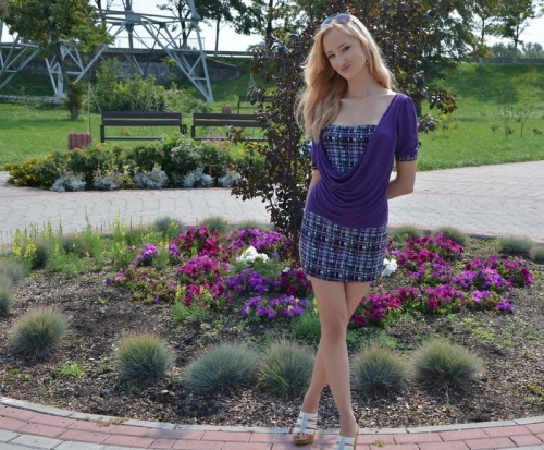 Seductive Long-Legged Woman Poses Provocatively on the Street
