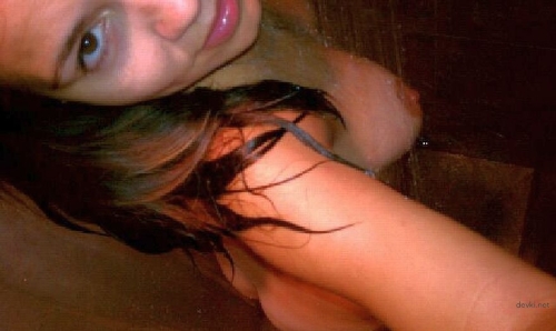 Woman caressing her genital lips - explicit and sensual self-pleasure.