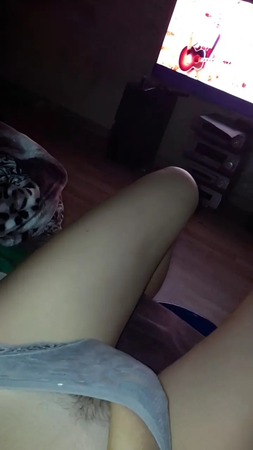 Young girl slips hand into panties for explicit pleasure