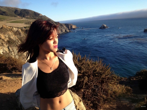 Stunning Asian Babe in Erotic Pose: Seductive and Alluring Beauty