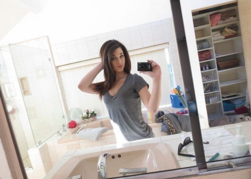 Sexy Girl with Cute Face Takes Provocative Selfies