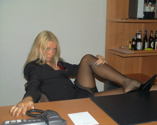 Secretary posing in office: Explicit and Bold Photoshoot