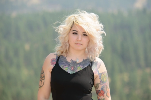 Blonde Babe Flaunts Nude Body Ink in Explicit Display