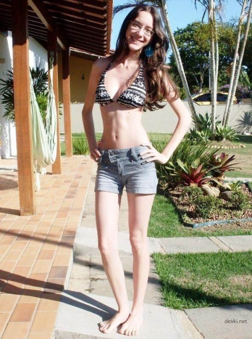 Slim Girl in Glasses: Seductive and Provocative Beauty in Lingerie