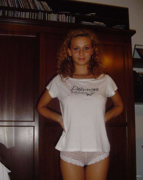 Half-naked girl in panties flaunting her curves