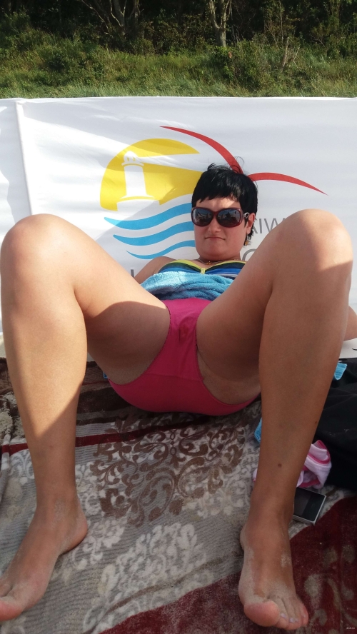 Naked Woman on Beach: Explicit Nude Sunbathing Scene