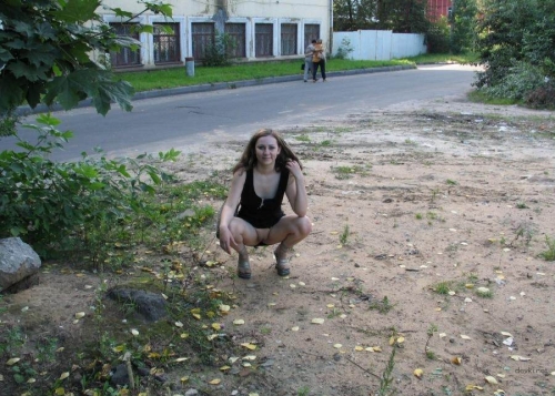 Young girl on the street shows pussy - Explicit Public Display
