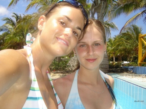 Hot Babes on Vacation: Bikini Babes Sunbathing Together in Provocative Pose