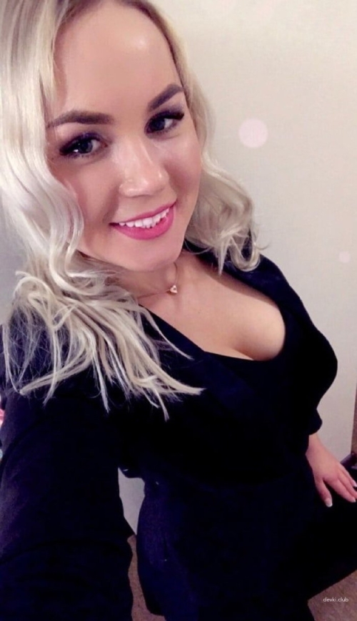 Spread Legs: Sexy Girl Shows Off in Provocative Pose