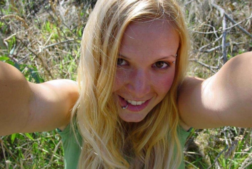 Sexy Blonde with Lip Piercing Seductively Poses - Explicit Adult Content