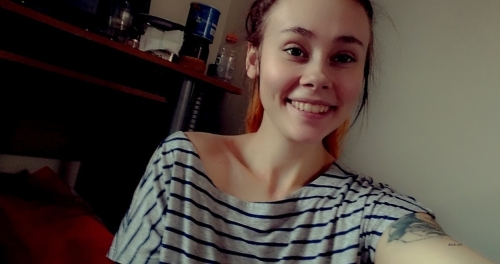 Busty Smiling Beauty: Explicit Seduction in Provocative Pose